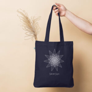 Navy blue tote bag featuring a geometric sacred signs design