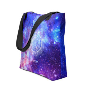 A starry galaxy blue-purple tote bag with the word Peace and sacred geometric circles, framed by black handles and straps.