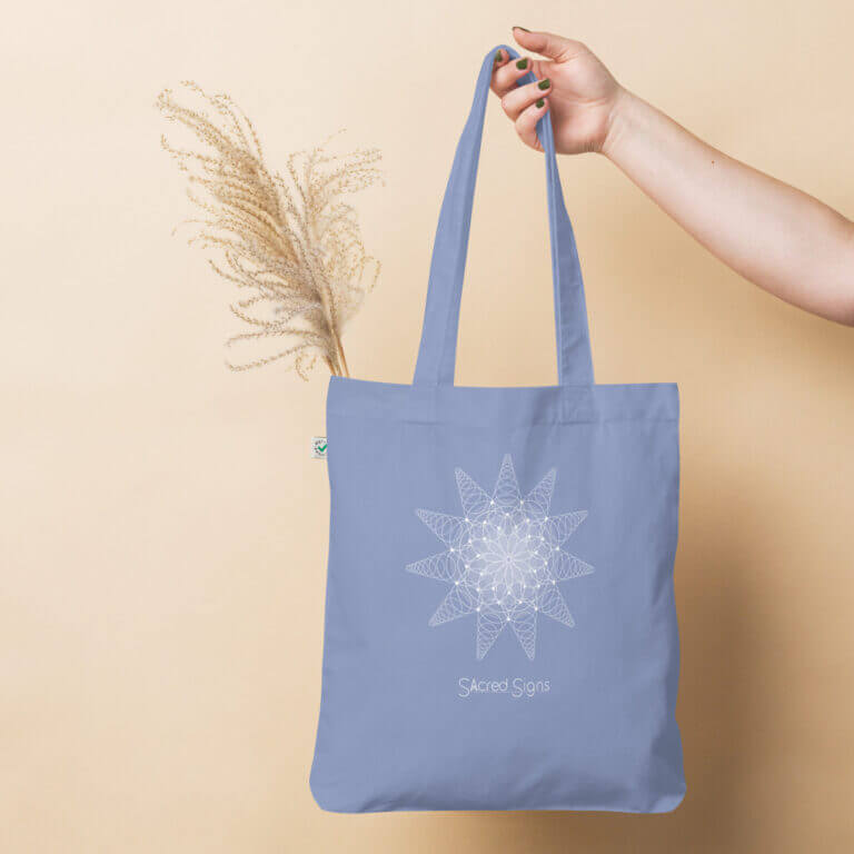 Light blue tote bag featuring a geometric sacred signs design, ideal for eco-friendly shopping and daily use.