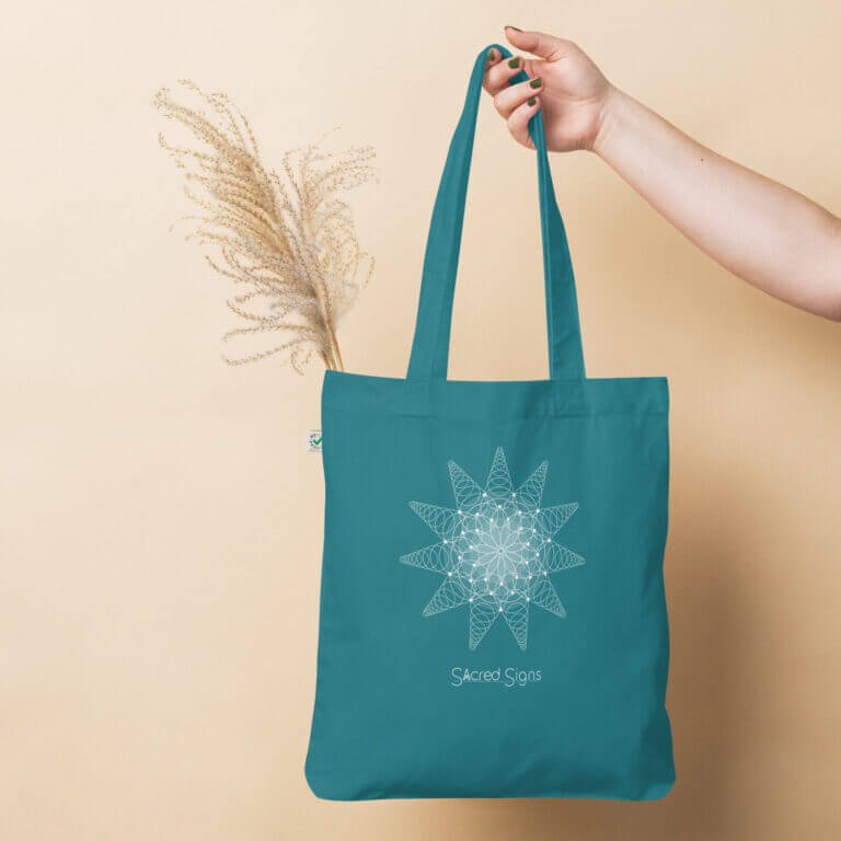 Teal tote bag featuring a geometric sacred signs design, ideal for eco-friendly shopping and daily use.