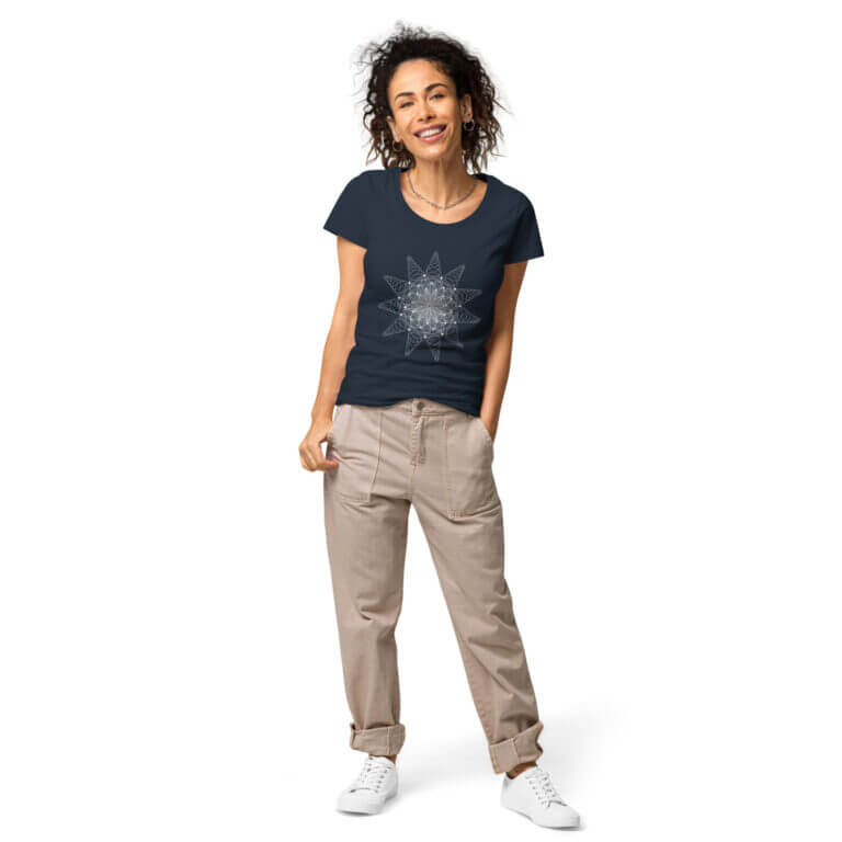 Women's navy graphic t-shirt featuring a star design, paired with beige pants and white sneakers, showcasing casual style.